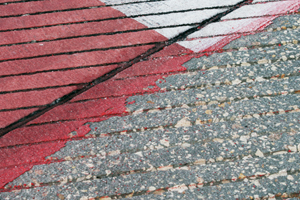Airfield paint marking being stripped from asphalt