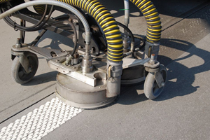 Waterjet recovery head removing road markings